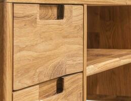 Table drawers with handles close view photo, wooden furniture background photo