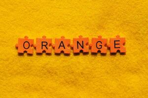 orange word on yellow background photo