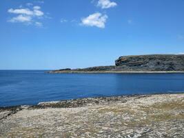 Cliffs and Atlantic ocean background, rocks and laguna, beauty in nature. Vacation trip wallpaper photo