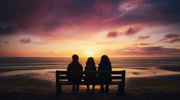 Tourism and summer holidays in northern France children on a beach bench vibrant sky tones with shadows. silhouette concept photo