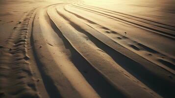 Abstract picture of tire track in sand representing transportation or difficult weather traffic conditions. silhouette concept photo