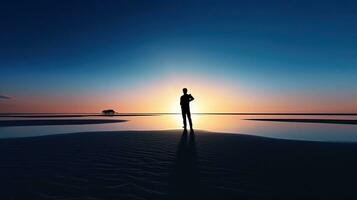 Man photographs on white sand. silhouette concept photo