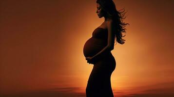 Silhouette of pregnant woman photo