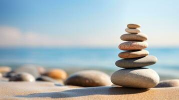 Zen stones on the sea beach representing meditation spa harmony and balance with a soothing background of abstract sea bokeh on a sunny day. silhouette concept photo