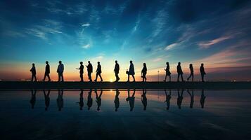 Twilight walkway with blurred silhouettes of walking people photo