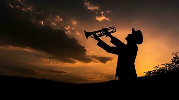 Trumpet playing in silhouette photo