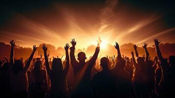 Audience members raising hands at a concert. silhouette concept photo