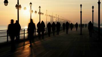 Dark figures of individuals on Scarborough pier. silhouette concept photo