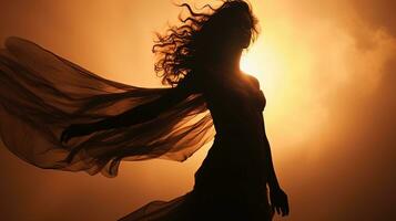 a woman in a long dress is silhouetted against the sun photo