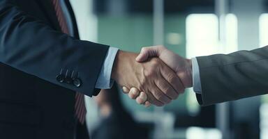 A crucial business meeting with a client, with focus on the handshake that signifies agreement photo