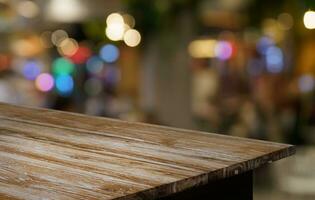 Empty wood table top and blur of out door garden background Empty wooden table space for text marketing promotion. blank wood table copy space for background photo