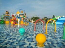 Water boom Swimming Pool in the morning under the blue sky photo