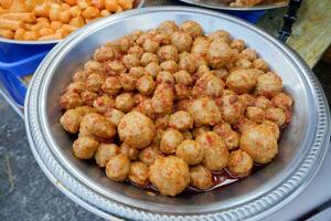 Beef meatballs in spicy sauce are sold at culinary festivals photo