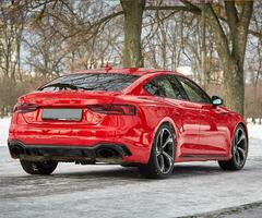 Modern red sport car in the winter forest background,  car wallpaper photo