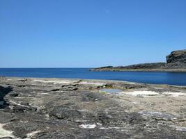 Cliffs and Atlantic ocean, clouds, rocks and laguna, beauty in nature. Vacation trip relaxation background photo