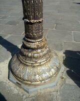 Old bronze column in Paris, France photo