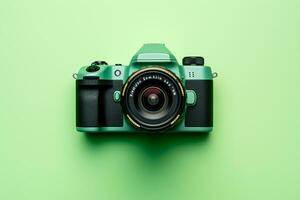 Retro camera on a green background, top view, flat lay photo