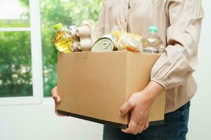 Foodstuffs in donation box for volunteer to help people. photo