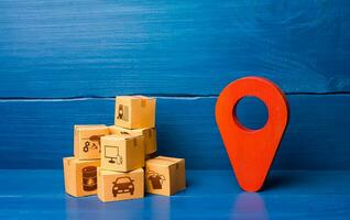 Red location pointer symbol and cardboard boxes. Transport logistics distribution delivery of goods to consumer customer. Adjusting the business to the new quarantine rules. Online sales growth photo