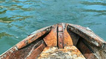 a close up view of a wooden boat on the water photo