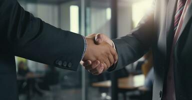 A crucial business meeting with a client, with focus on the handshake that signifies agreement photo