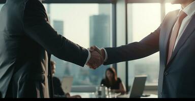 A crucial business meeting with a client, with focus on the handshake that signifies agreement photo