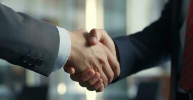 A crucial business meeting with a client, with focus on the handshake that signifies agreement photo