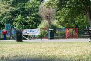 Beautiful Low Angle View of People are Enjoying the Starting of Summer at Wardown Public Park of Luton Town of England UK. The Footage Was Captured on Beautiful Day of June 22nd, 2023 photo