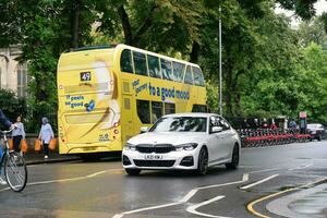 Gorgeous Low Angle view of Bus Service and British Traffic at Central London City of England UK. Image Captured on August 2nd, 2023 During Cloudy and Rainy Day. photo
