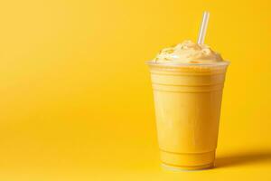 Mango smoothie milkshake in plastic takeaway cup isolated on yellow background with copy space. ai generated photo