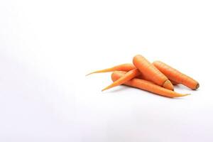 A pile of fresh carrots is isolated on a white background with copy space. ai generated photo