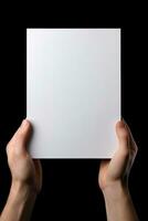 A human hand holding a blank sheet of white paper or card isolated on black background. ai generated photo