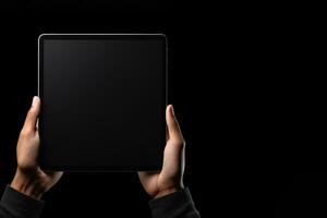 Hand holding tablet with mockup blank screen isolated on black background with copy space. ai generated photo