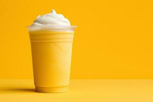 Mango smoothie milkshake in plastic takeaway cup isolated on yellow background with copy space. ai generated photo