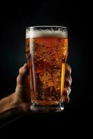 a male hand holding up a glass of beer isolated on a black background. ai generated photo