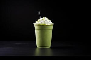 verde té frappucino con azotado crema en un para llevar taza aislado en oscuro antecedentes. ai generado foto