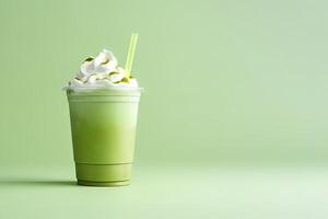 Green tea frappucino with whipped cream in a takeaway cup isolated on green background with copy space. ai generated photo