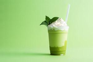 Green tea frappucino with whipped cream in a takeaway cup isolated on green background with copy space. ai generated photo