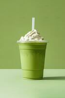 Green tea frappucino with whipped cream in a takeaway cup isolated on green background. ai generated photo