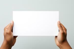 A human hand holding a blank sheet of white paper or card isolated on white background. ai generated photo