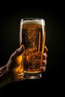 a male hand holding up a glass of beer isolated on a black background. ai generated photo