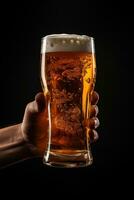 a male hand holding up a glass of beer isolated on a black background. ai generated photo