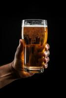 a male hand holding up a glass of beer isolated on a black background. ai generated photo