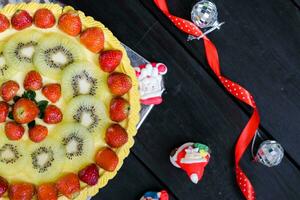 a cake with fruit on top photo