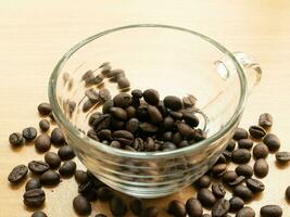 Roasted coffee beans and Cup of Coffee. Coffee Background photo