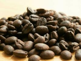 The roasted coffee on a wooden floor, suitable for use as a background image. photo