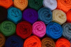 Blurry background of colorful knitting. View from above of colorful knitting. photo