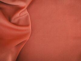 Fabric texture of natural cotton, wool, silk or linen textile material. Rose gold fabric background photo