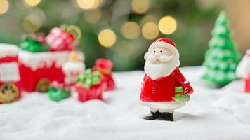 Santa claus doll with shiny light for Christmas decoration background photo