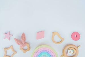 Newborn wooden toys and a star on a white background photo